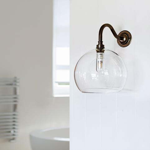 SOHO BATHROOM Clear Glass Globe Wall Light - Medium in Antique Brass